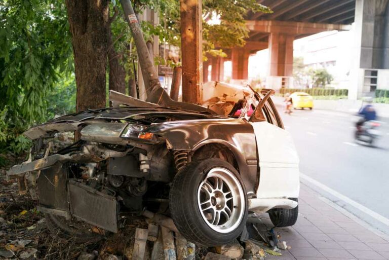 A car ran into a guard rail.