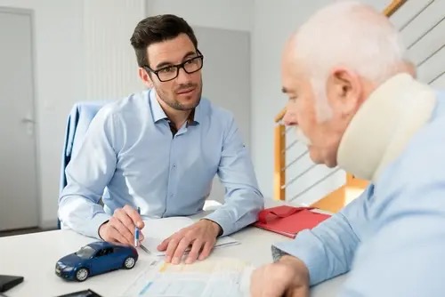 Injured man filing a personal injury claim with lawyer