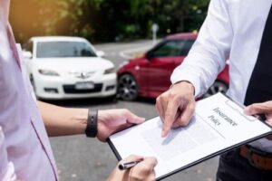 Driver dealing with insurance company after a car crash