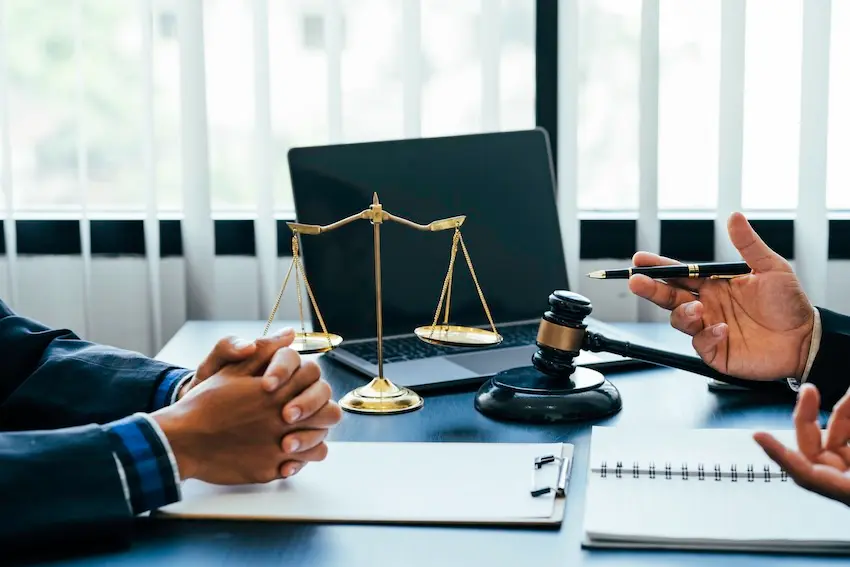 How Trucking Company Negligence Causes Serious Accidents in Georgia Experienced truck accident attorney meeting with an injured client for a free consultation at Wade Law Office in Georgia regarding the liability of the trucking company involved in his truck accident claim.