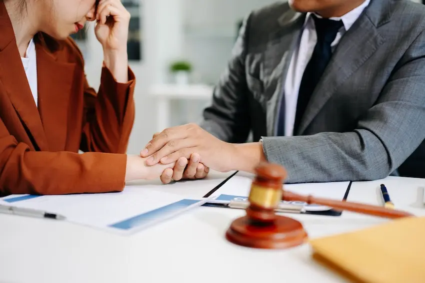 How Are Punitive Damages Awarded in a Georgia Car Accident Case? Car accident victim consulting with attorney about punitive damages claim in Georgia