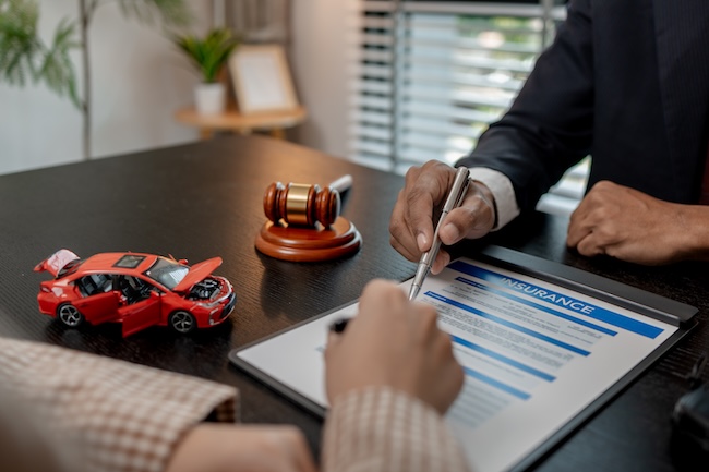 Georgia car accident victim receiving a call from an insurance adjuster representing the recorded statement tactic that Fayetteville car accident lawyers at Wade Law protect clients against