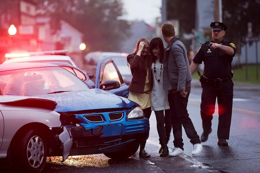 What tactics do insurance companies use to reduce your car accident payout in Georgia? Two drivers disputing fault at a Georgia car accident scene representing the manufactured shared fault tactic that Wade Law Fayetteville car accident lawyers counter for clients