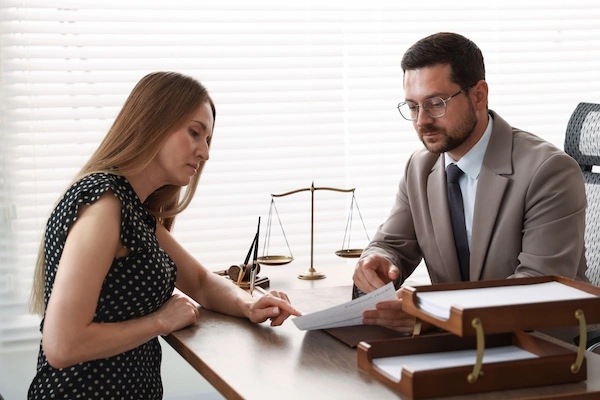 Fayetteville Bicycle Accident Lawyer A Fayetteville bicycle accident lawyer from Wade Law Office Injury Lawyer is speaking with a client.