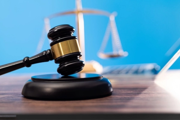Fayetteville Bicycle Accident Lawyer A gavel and scales of justice represent a Wade Law Office Injury Lawyer Fayetteville bicycle accident lawyer.